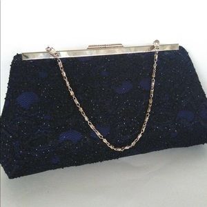 Navy blue sequined lace fabric over satin clutch